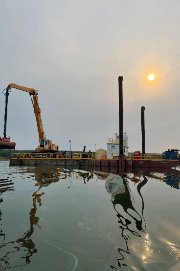 Dredger on water