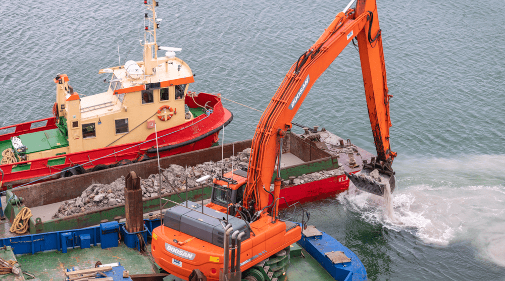 Dredger on water removing sediments fromt he bottom of a lake